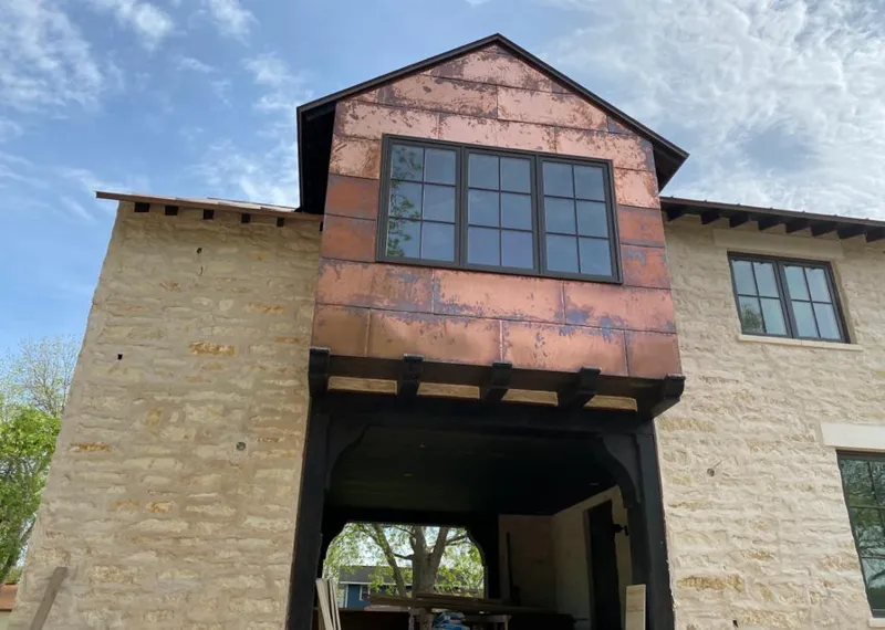 Copper metal panel facade on a stone building for Roof Repair in Cottonwood